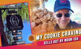 Hank holding a Gideon's Bakehouse coffee cake cookie at Disney Springs